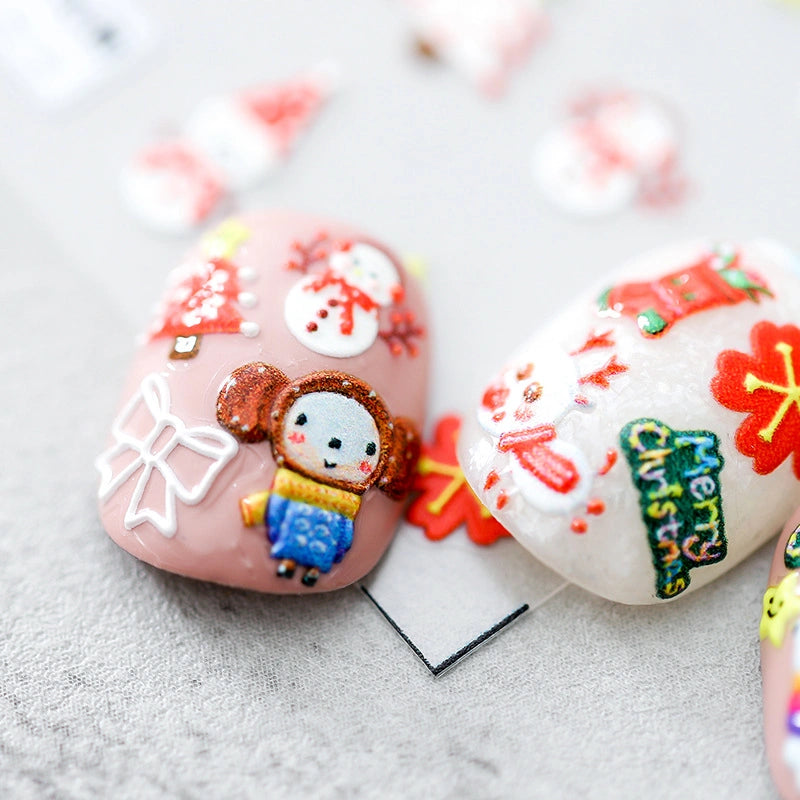 Christmas nail stickers applied on nails – festive holiday manicure design