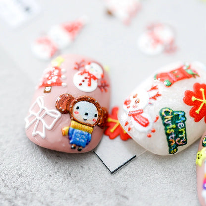 Christmas nail stickers applied on nails – festive holiday manicure design