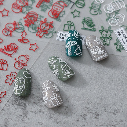 Christmas nail stickers with Santa Claus, reindeer and snowflake applied on nails – holiday nail art decals
