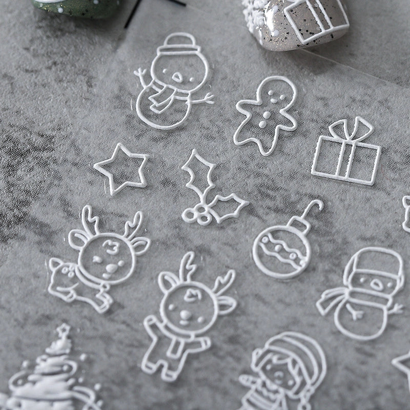 White outline Christmas nail stickers with reindeer, snowman and gift – minimalist holiday nail art
