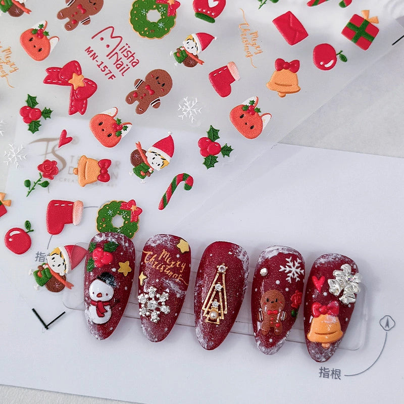Christmas nail decals applied on nails with stockings, gingerbread and festive holiday designs