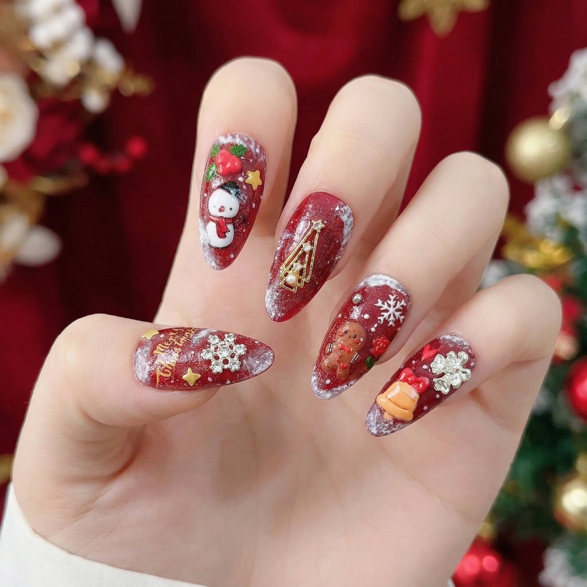 Christmas nail stickers applied on nails with snowman and gingerbread designs – festive holiday manicure
