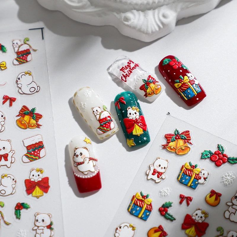 Christmas nail stickers with cute white bear, Christmas stocking and gift designs applied on nails – festive holiday nail art