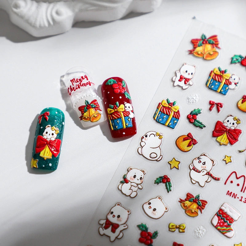 Christmas nail stickers with white bear, gift box and holiday bells on red and green nails – festive nail art design