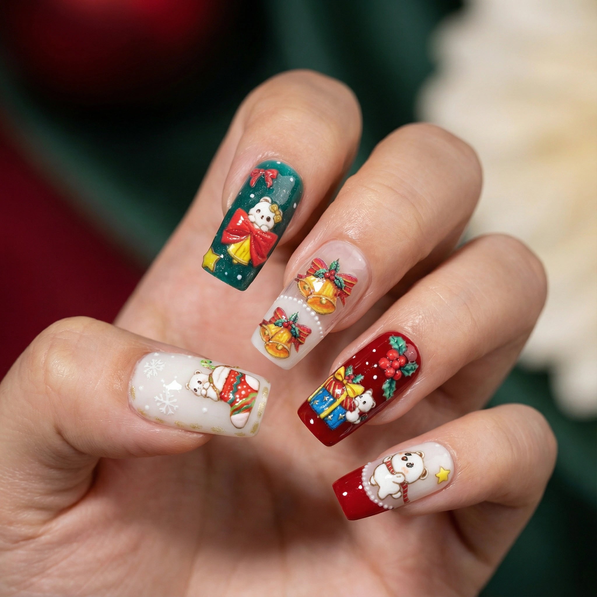 Christmas white bear nail stickers applied on nails with gifts, bells and stockings – festive holiday manicure