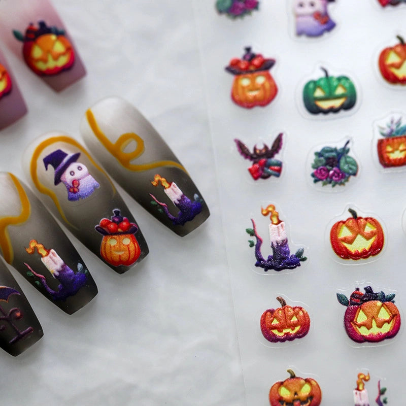 Halloween-themed nail art with pumpkins, ghosts, and witches 