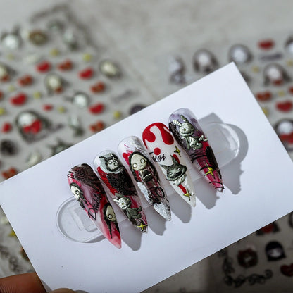 Five sharp-shaped dark finished nails, integrating gothic cartoon elements, using dark red, black, and silver colors, with splashing ink and glitter techniques, having a strong visual impact