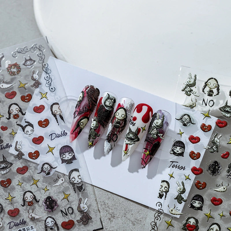 dark gothic nail art stickers, featuring grotesque cartoon characters, red hearts, golden stars, and the word "Diablo", paired with sharp-shaped dark nails, with a mysterious and personalized style